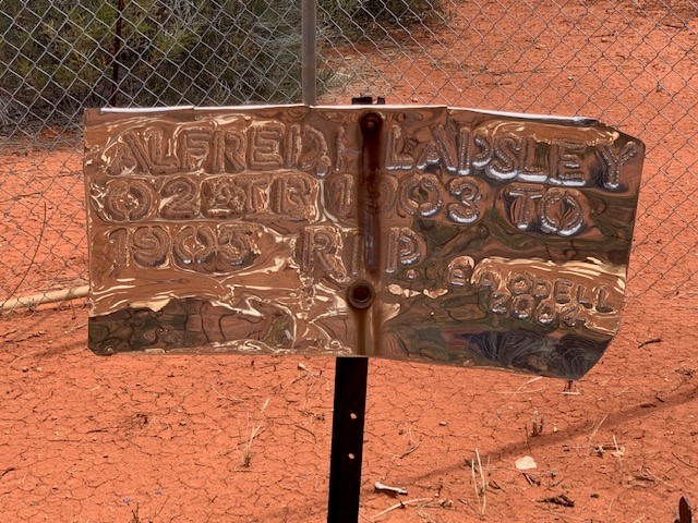 This is a ;photograph of the hand-made signage designating the grave for Alfred LAPSLEY